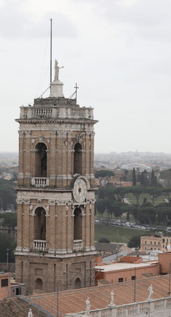 High clock tower of the town hall of Rome in capitoline square also called Piazza del Campidoglio