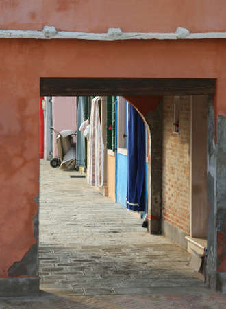 small narrow arcade passage in the Island called Sottoportico in italian languageの写真素材