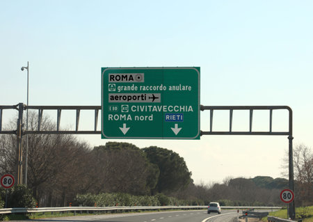 road junction in the italian highway and indications to ROME or Civitavecchia city and other italian...
