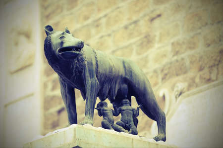 she-wolf called LUPA CAPITOLINA in Rome in Italy with Remus and Romulus children with old toned effectのeditorial素材