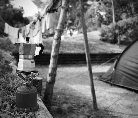 used moka used to prepare breakfast coffee in a camping  with black and white effectの写真素材