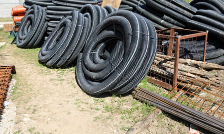construction site with many corrugated pipes for laying fiber optics for high-speed internet connectionの写真素材