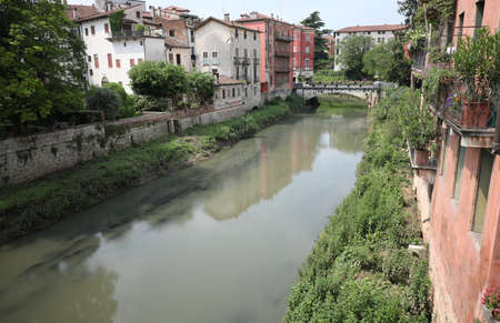 Retrone river in Vicenza City in Italy and the Saint Paul Bridge in Backgroundの写真素材