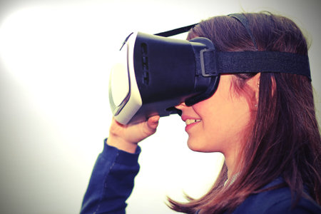 virtual reality headset used by a pretty little girl and the spot light
