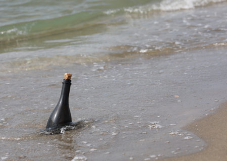 Message in a bottle by the sea