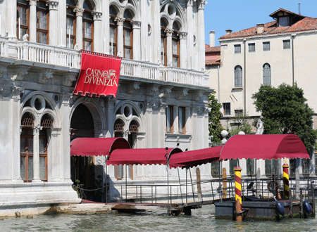 Venice, VE, Italy - July 10, 2019: Entrance of the Venetian Casino on the Grand Canalのeditorial素材