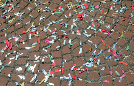 Venice Carnival and the colorful confetti on the paved floor
