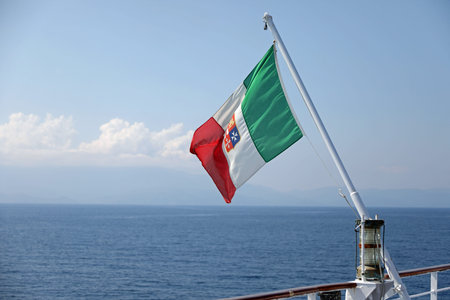 Italian flag on the Cruise Ship liner and the mediterranean sea