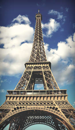 Fantastic Eiffel Tower symbol of Paris in France and the white clouds in sky and the dark toned effectの写真素材
