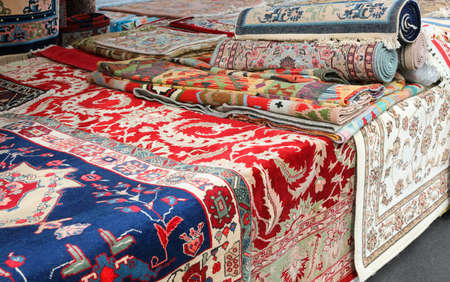 market stall specializing in the sale of precious handmade oriental rugsの写真素材