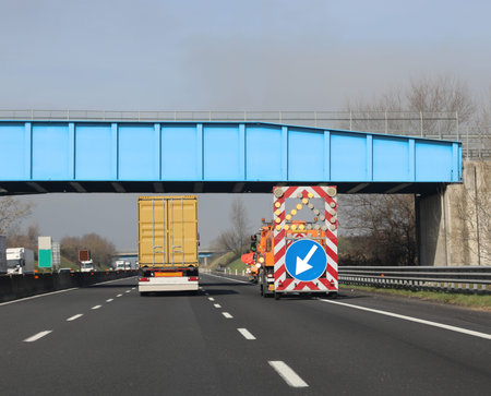 overtaking the truck on the highway and the vehicle to indicate the work in progress with the large...