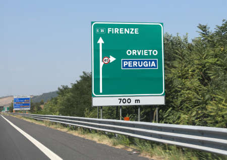 Traffic sign on the italian highway to Florence City or Orvieto Town near Perugia in Umbria Regionの写真素材