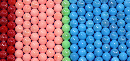 background of many colorful pearls pink green and blue and red