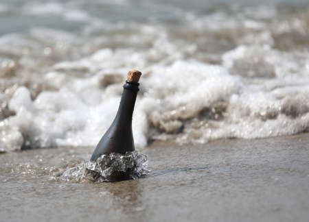 bottle of glass on the sea perhaps with a secret messageの写真素材