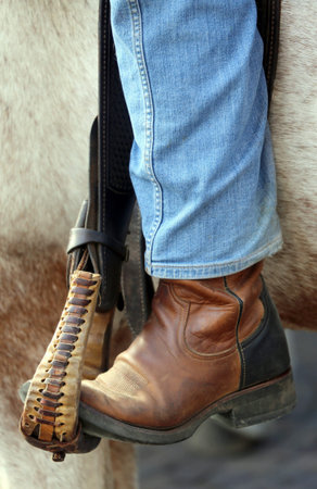 boot of Cowboy in the stirrup of the horseの写真素材