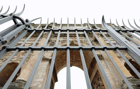 high iron railing of protection to the Arch of Constantine the famous moumento in Rome in Italyの写真素材
