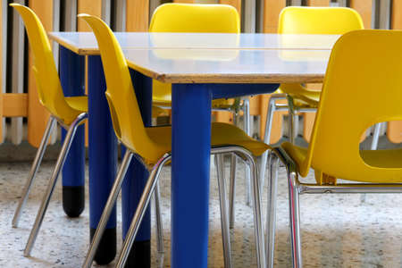 yellow chairs in the classroom of the school wihtout kidsの写真素材