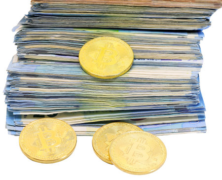bitcoin money and a pile of money in european banknotes on a white background