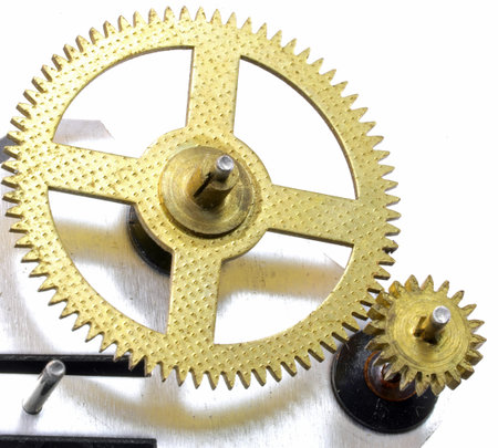 small golden gears of a mechanical part photographed by special macro lens