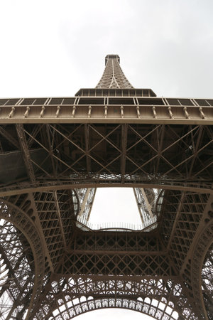 Eiffel tower in Paris France seen from below with white background
