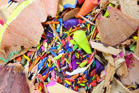 iridescent background of many colorful shavings of colored pencils and broken tipsの写真素材