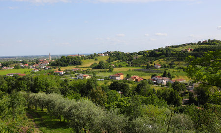 panorama of the hills with few houses and cultivated fields and the plain in the background