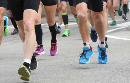 many athletes participate in a road marathonの写真素材