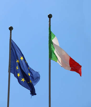 Blue European flag with yellow stars and the Italian tricolor FLAGの写真素材