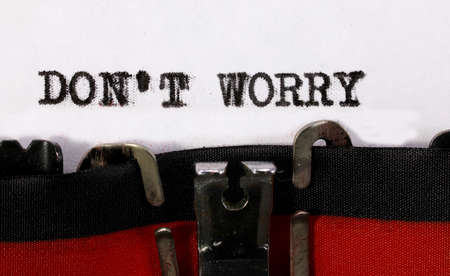 Phrase dont Worry on old vinatge typewriter on white paper sheetの写真素材