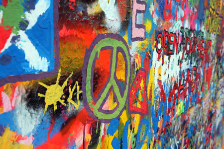 Prague, Czech Republic - August 23, 2016: Peace symbol on the Lennon wall and many drawingsのeditorial素材