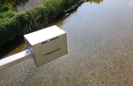 hydrometric probe with stainless steel protection to measure the height of the river belowの写真素材