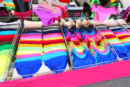 Underwear stalls with very colorful underwear and tank tops for sale at marketの写真素材