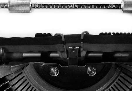 detail of the typewriter with a blank sheet of paper without any writing, ideal for personalizing your own text or messageの写真素材