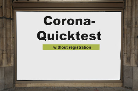 advertising panel in the wall of a pharmacy offering a rapid test for coronavirus without registrationの写真素材