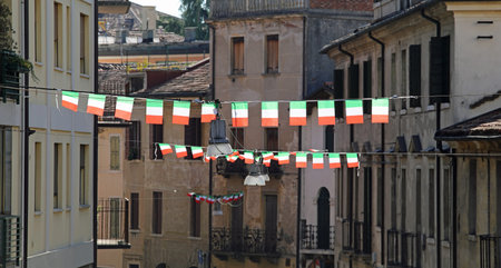 many small italian flags in the city of Italy
