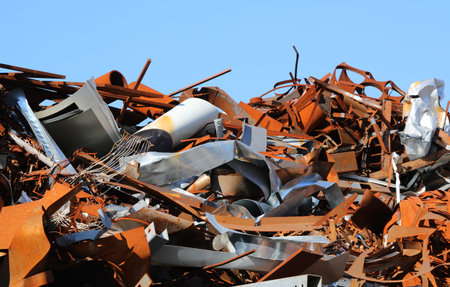 many rusty ferrous scrap in a controlled landfill of a foundry