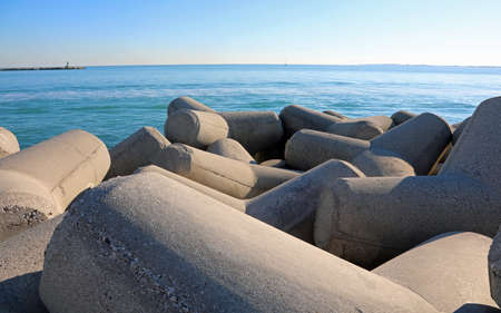 large concrete breakwaters to protect the beach from storm surges and the seaの写真素材