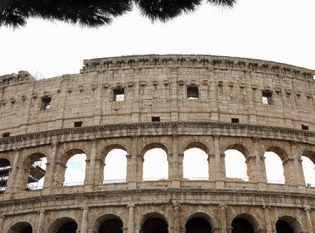 splendid external view of the amphitheater called Colosseum in the city of Rome