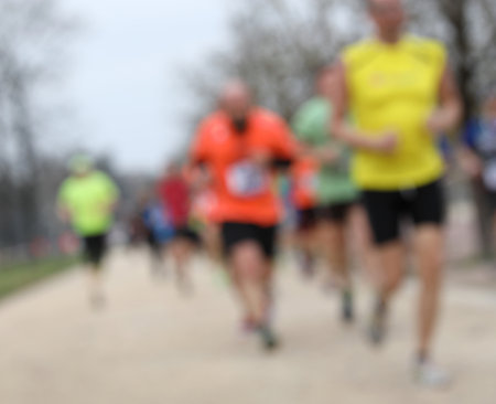 Intentionally blurred background with many runners during the foot race outsideの写真素材