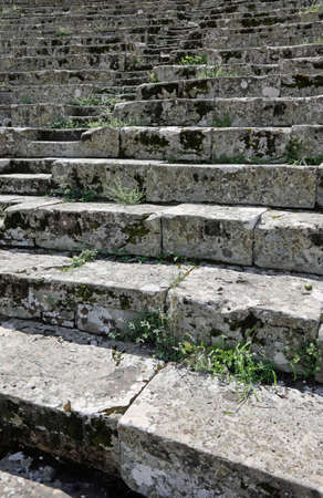 detail of the staircase with the stone steps of a Roman ruin of an ancient amphitheater in Europeの写真素材