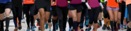 intentionally blurred ideal for background many legs of people running during the foot race