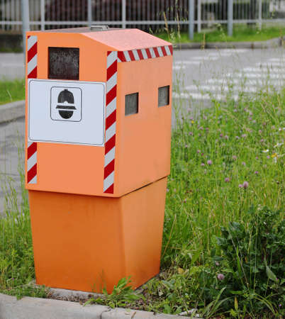 Big Orange System Traffic Enforcement Camera on the road with symbol of policeの写真素材