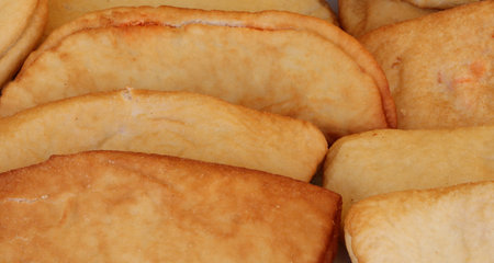 background of Italian Typical food called PANZEROTTO also called panzarotto a turnover like mini...