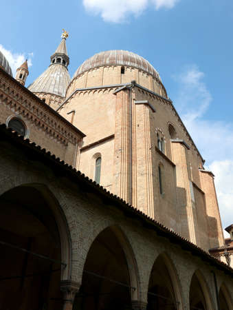 Basilica of Saint Anthony of Padua in the Veneto Region in Northern Italy in Southern Europe with dome and architectural arches in the inner courtyardの写真素材