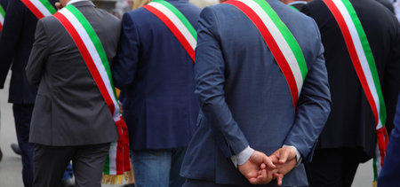 Many italian mayors with tricolor green white and red band during meetingの写真素材