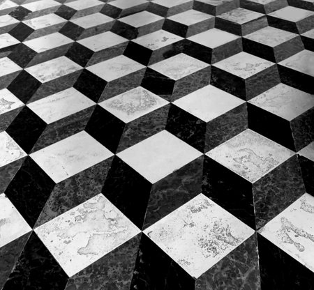 three-dimensional effect made many cubes and parallelepipeds in black and white of an ancient floorの写真素材