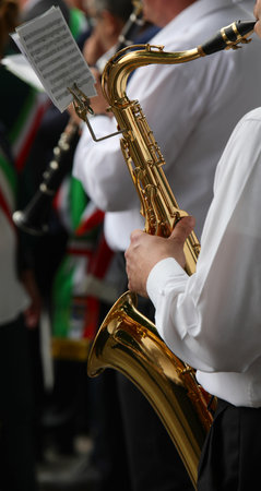 saxophone player's sax during the musical event and the scoreの写真素材
