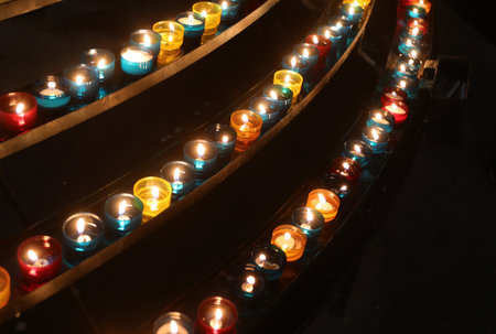 candles in the church for the prayers of the faithful during the religious ceremonyの写真素材