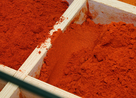 paprika powder and other hot and exotic spices for sale at the marketの写真素材