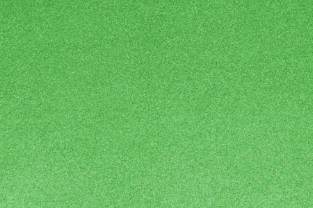 GREEN shimmering glitter material background with glowing effects and light reflectionsの写真素材